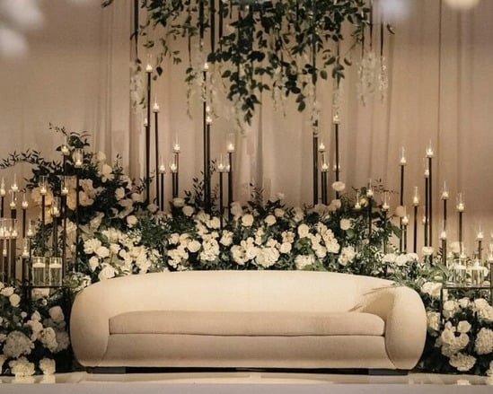 Elegant wedding setup with flowers & candles.